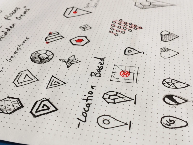 Hand-drawn sketch page exploring diamond and gem-shaped logo concepts, with notes on 'hidden gems' and 'location based' ideas