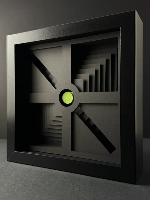 NF-01. Angled view showing the depth of the frame and stepped paper layers around the lime center.