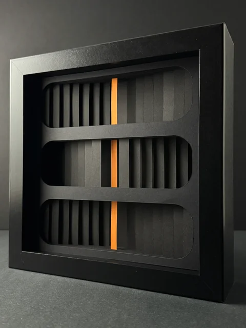 NF-03. Angled view of the rounded paper openings and orange core.