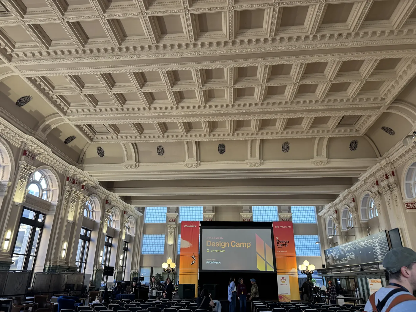 The AIGA Minnesota Design Camp 2025 "Daybreak" main stage in a historic vaulted hall