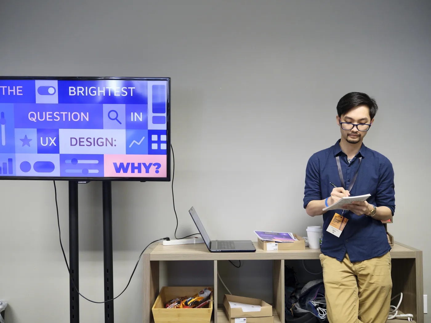 Alan Gi presenting "The Brightest Question in UX Design: Why?" at AIGA Minnesota Design Camp 2025